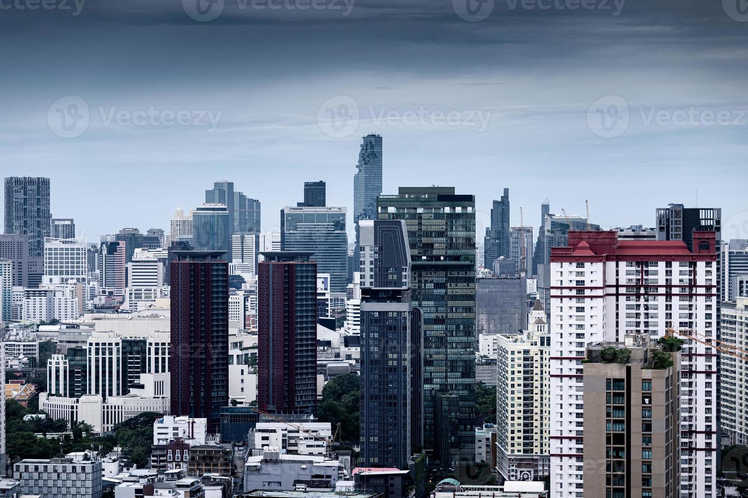 Bangkok city with high rise building in downtown on gloomy day photo