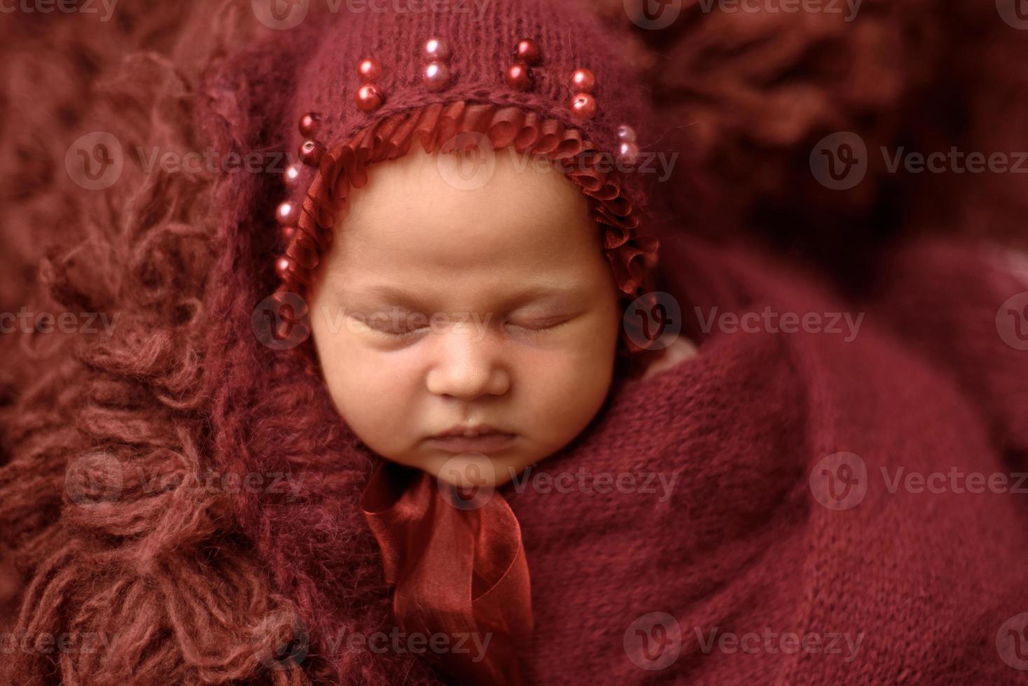 Newborn baby sleeping on flocci photo