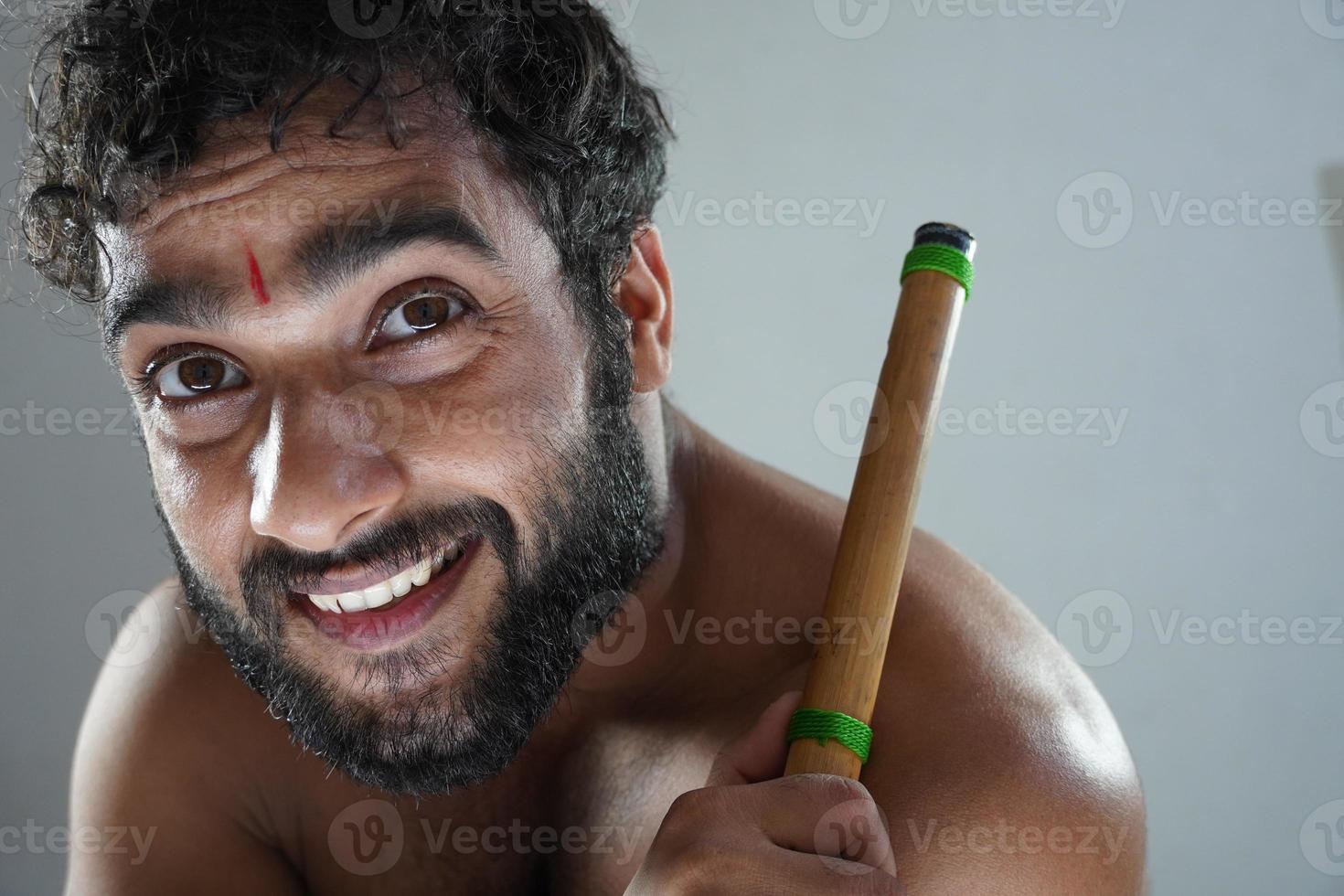 indian hindu man with flute with and happy face photo