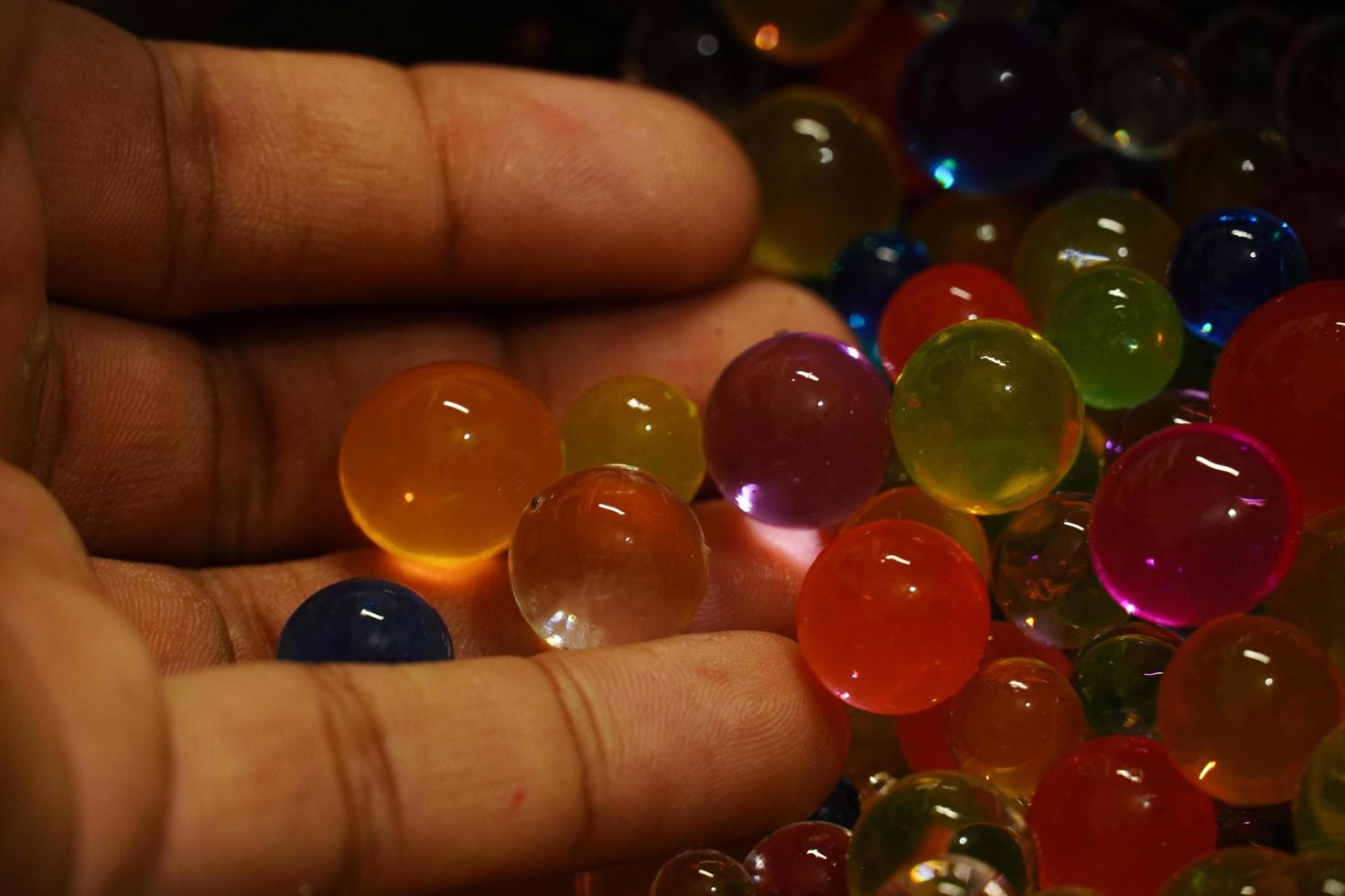 coulorful bubbles in the hand photo