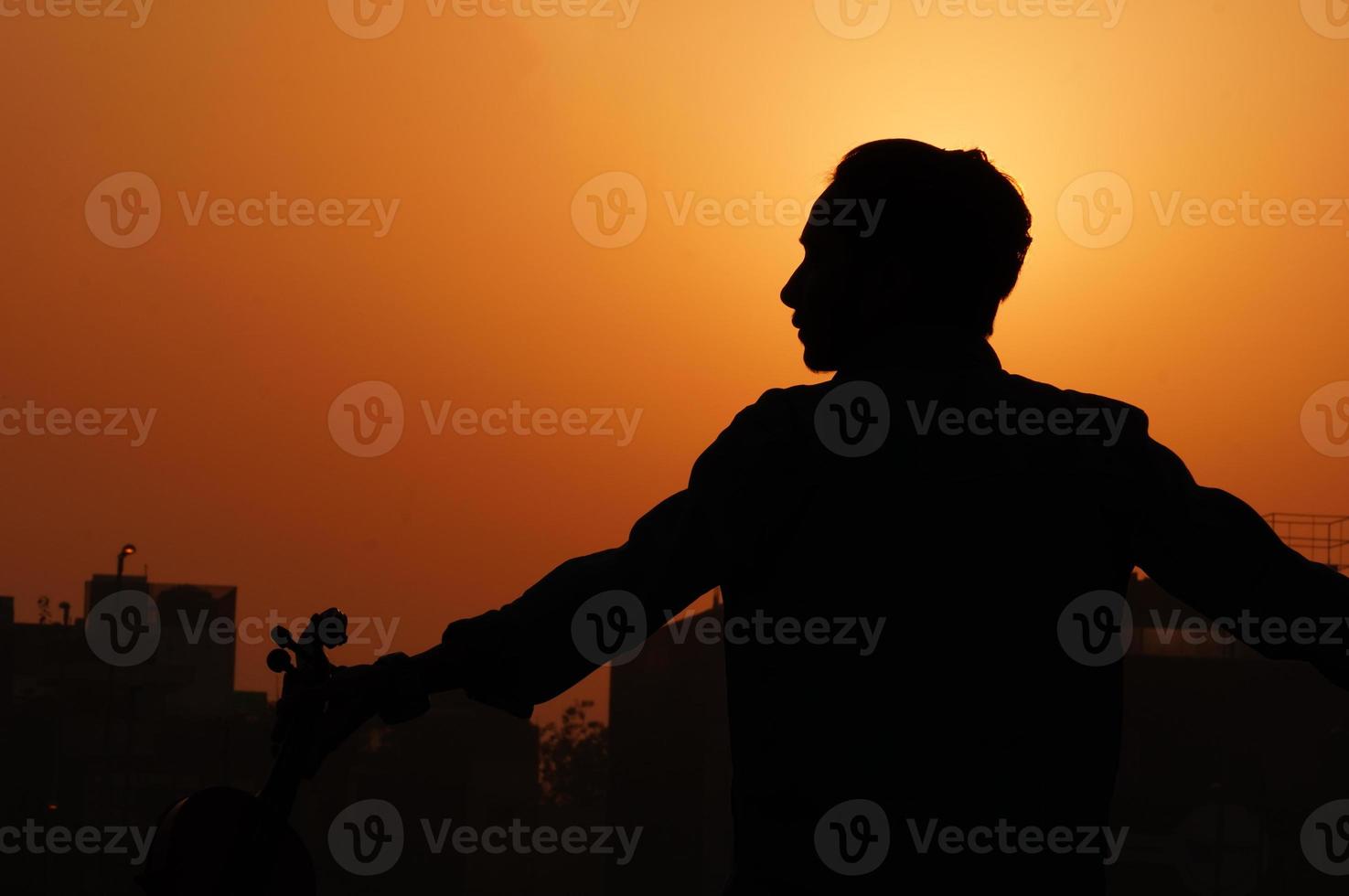 silhouette images of man musician photo