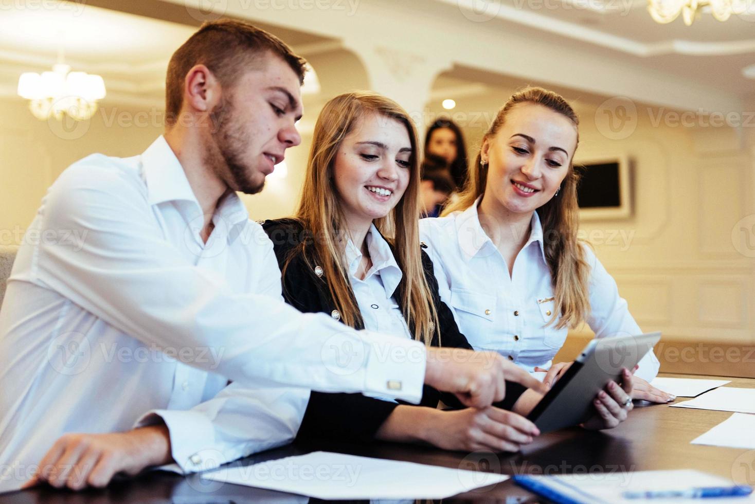 Group of students studying using a laptop photo