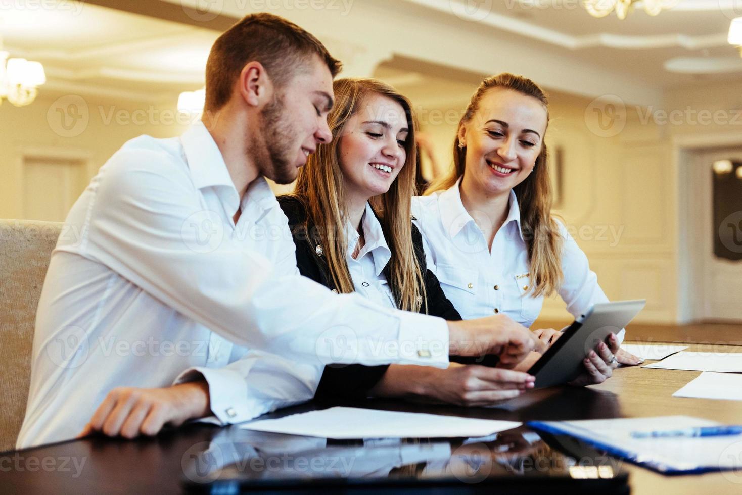 Group of students studying using a laptop photo
