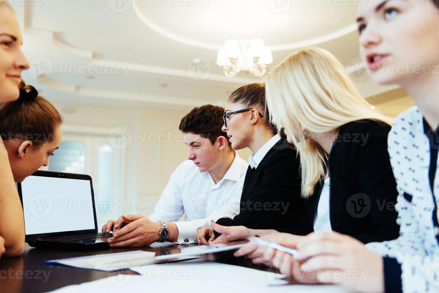 Group of students studying using a laptop photo