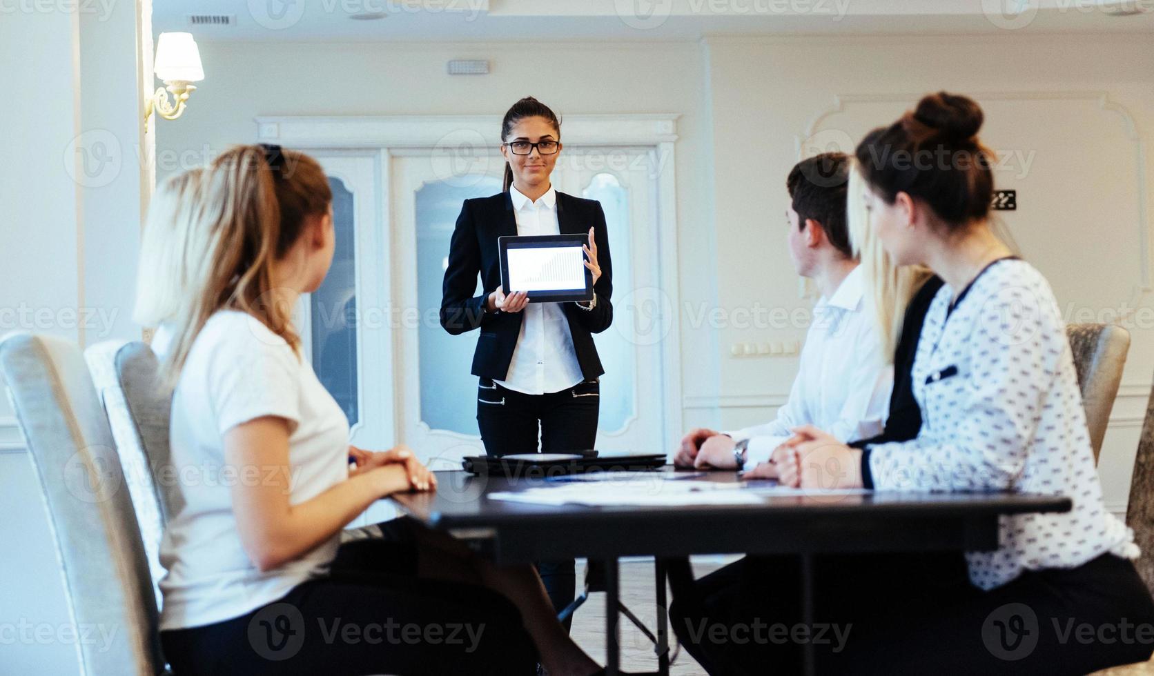 Group of students studying using a laptop photo