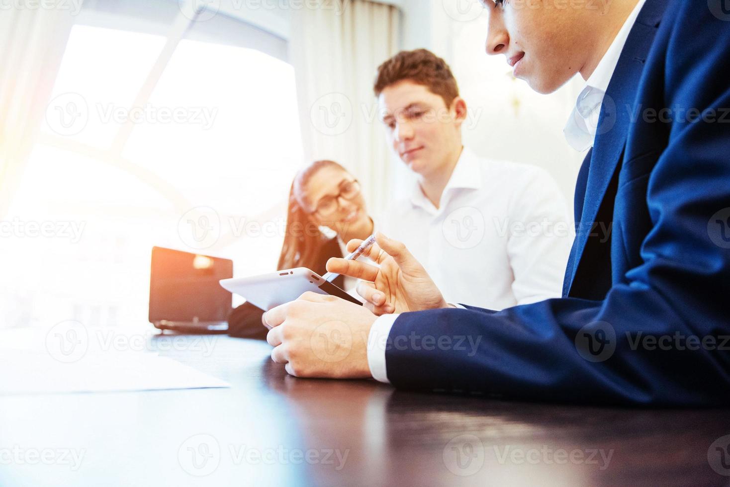 Group of students studying using a laptop photo