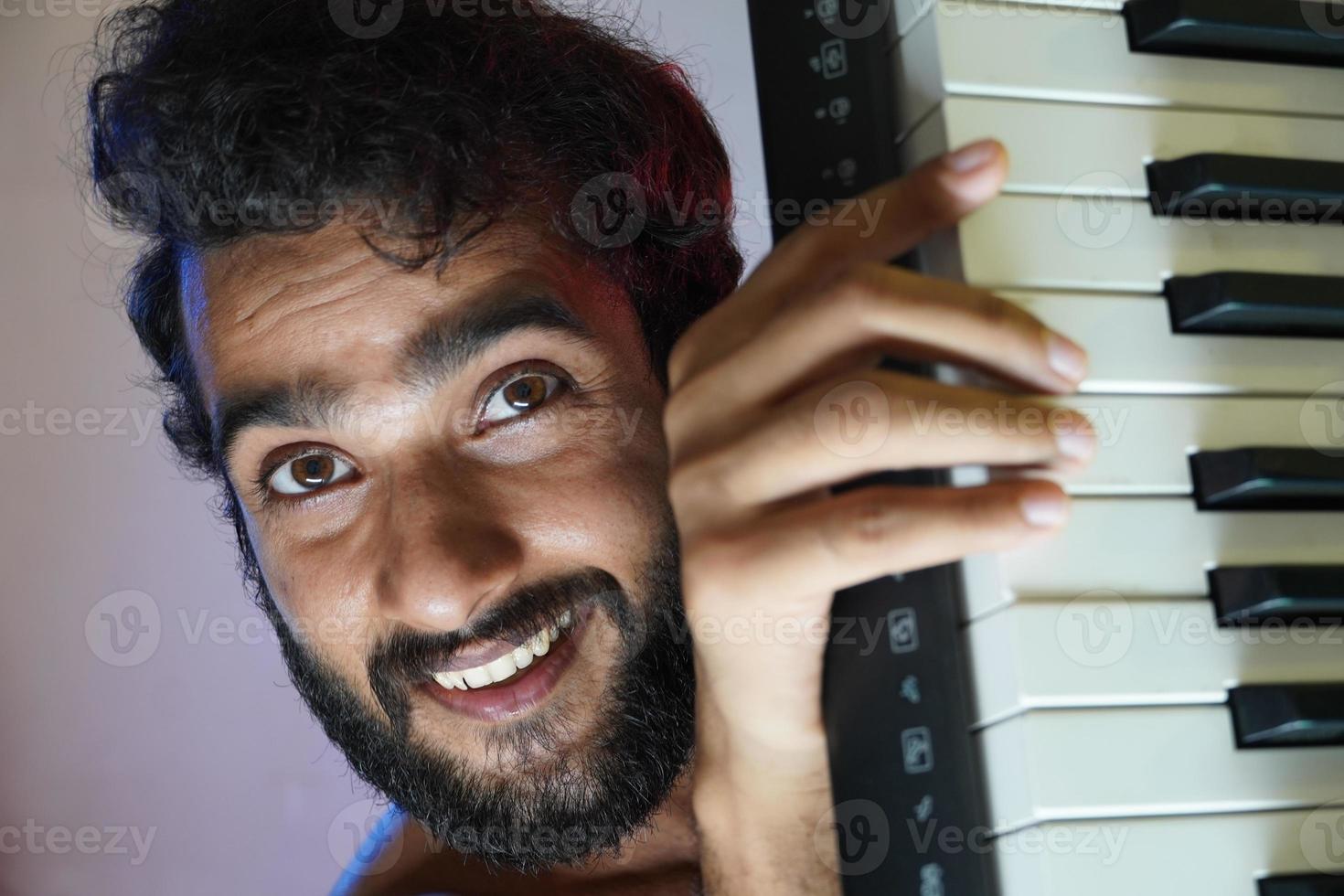 man with electronic piano photo