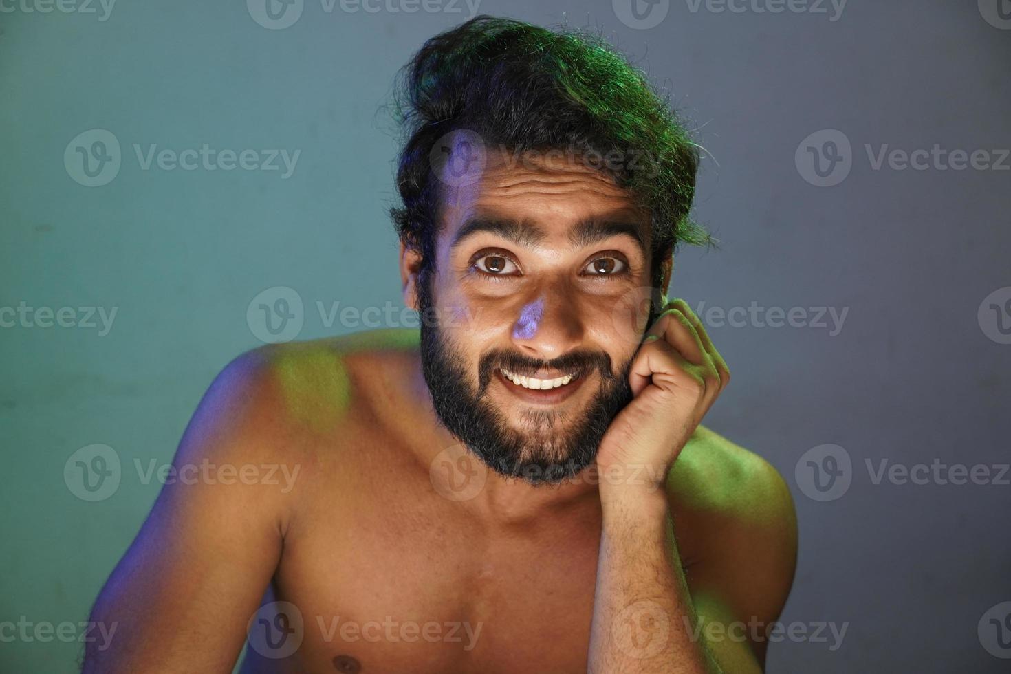 young man smiling face without cloths studio shot photo