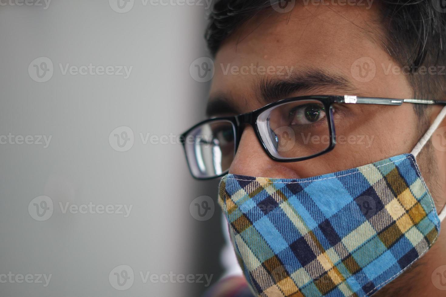 closup of a man in wearing mask due to Covid photo