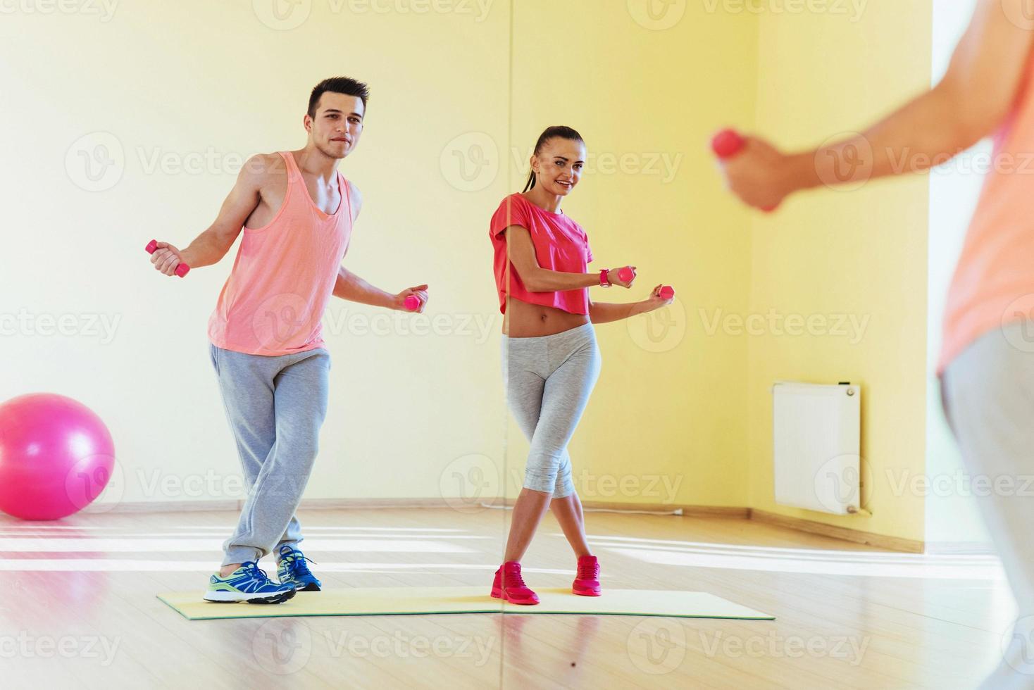 fitness, sport, training, gym and lifestyle concept - two smilin photo