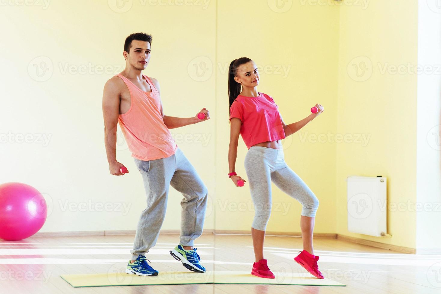 fitness, sport, training, gym and lifestyle concept - two smilin photo