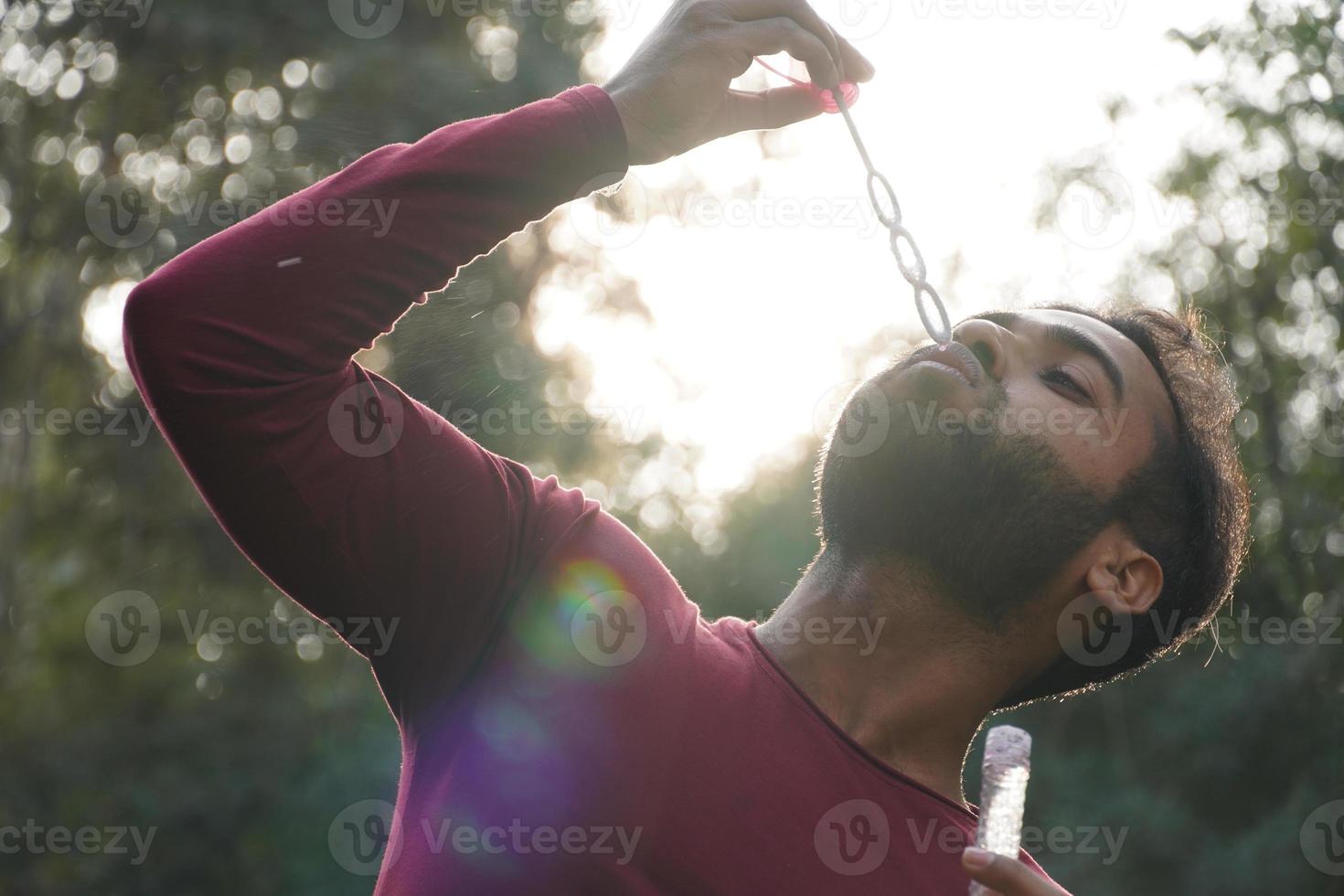 A boy making the bubbles photo