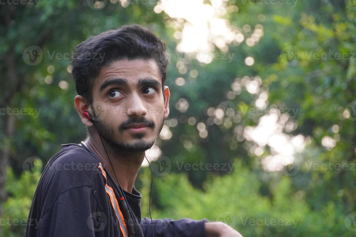 portrait of indian young man at outdoor photo