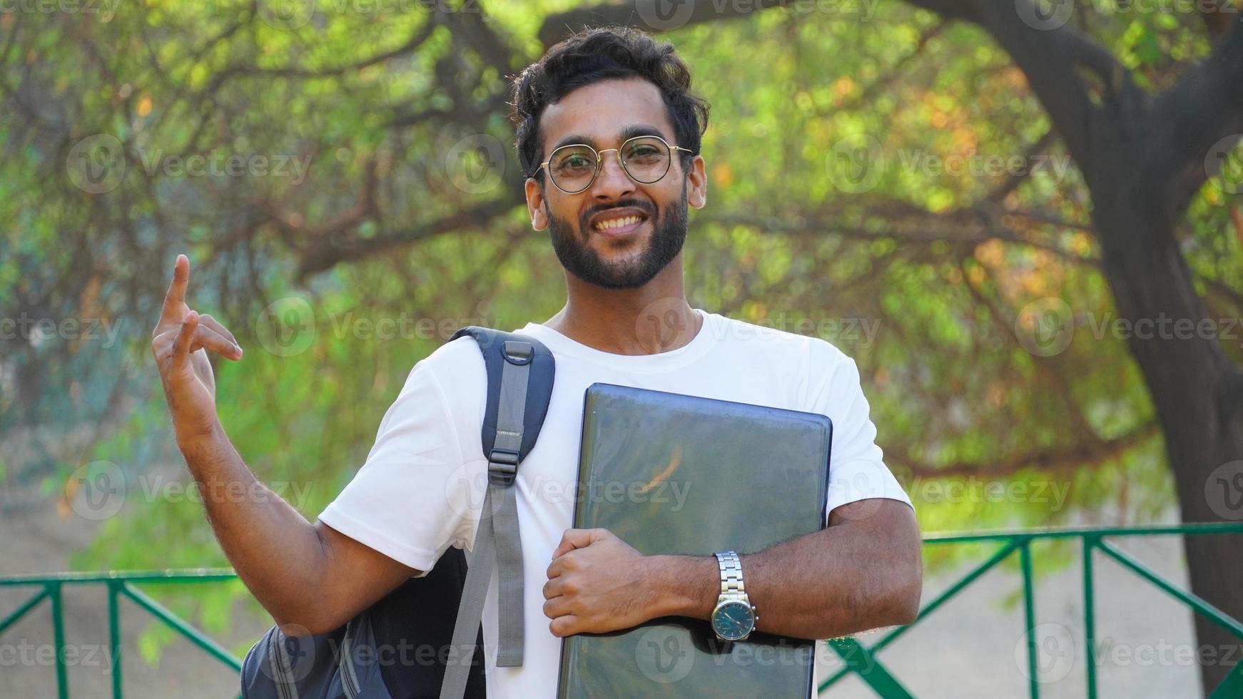 Smiling asian young Male with Laptop happy man image - online education concept photo