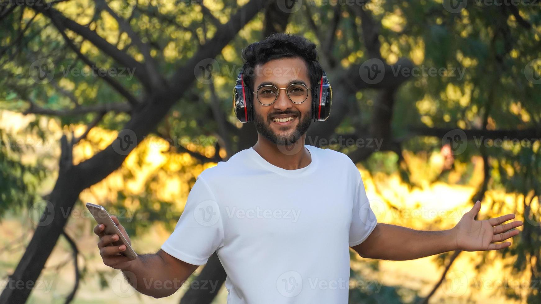 a man with headphone smiling photo