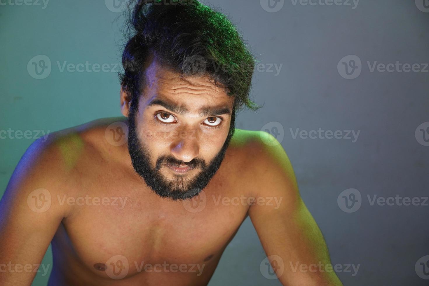 young man angry face without cloths studio shot photo