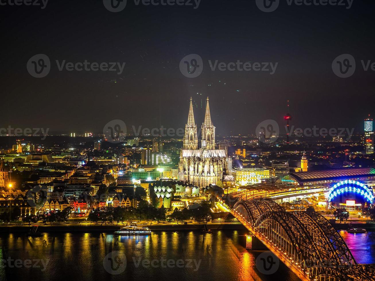 HDR Aerial night view of St Peter Cathedral and Hohenzollern Bri photo