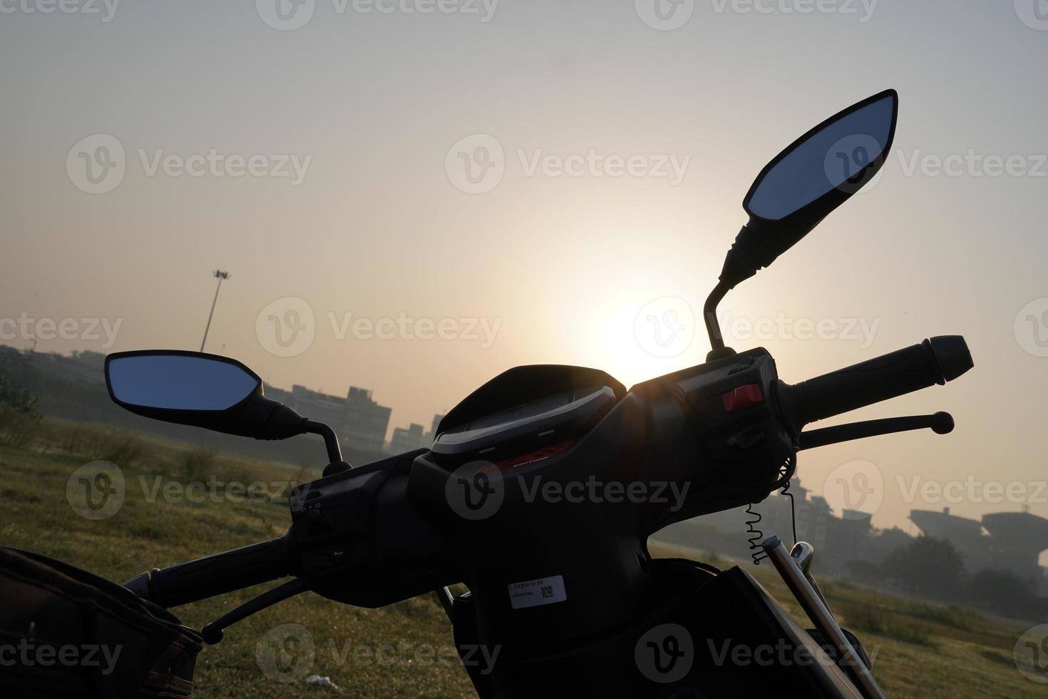 Handle of scooty motorcycle with switches. Black color handle of scooter photo