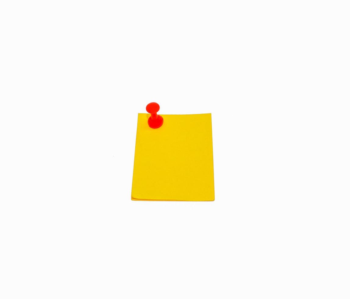 Yellow sticky notes and red pin needle isolated on white background photo