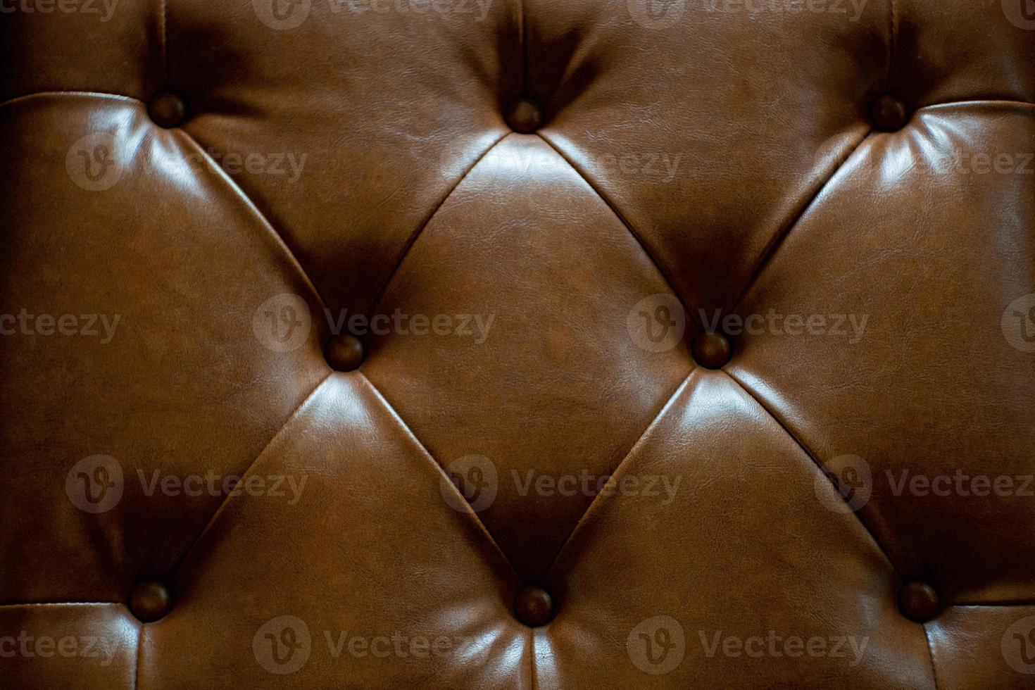 textura de cuero marrón con botones para patrón y fondo. - imagen foto