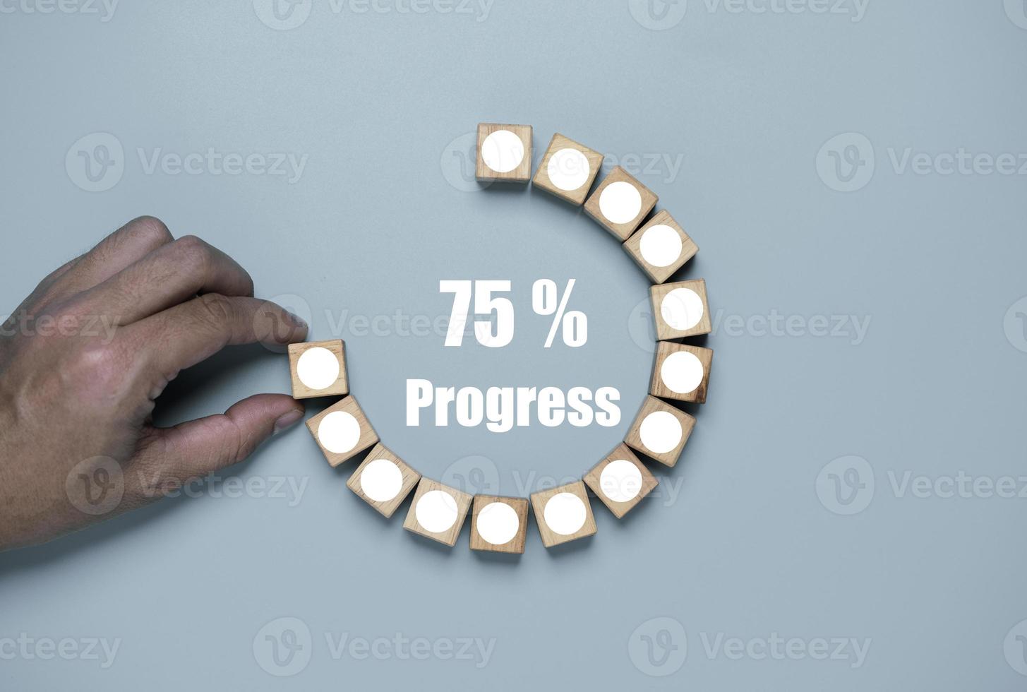 Hand array wooden block to circle shape on white background with progress wording for job and project progressive concept. photo