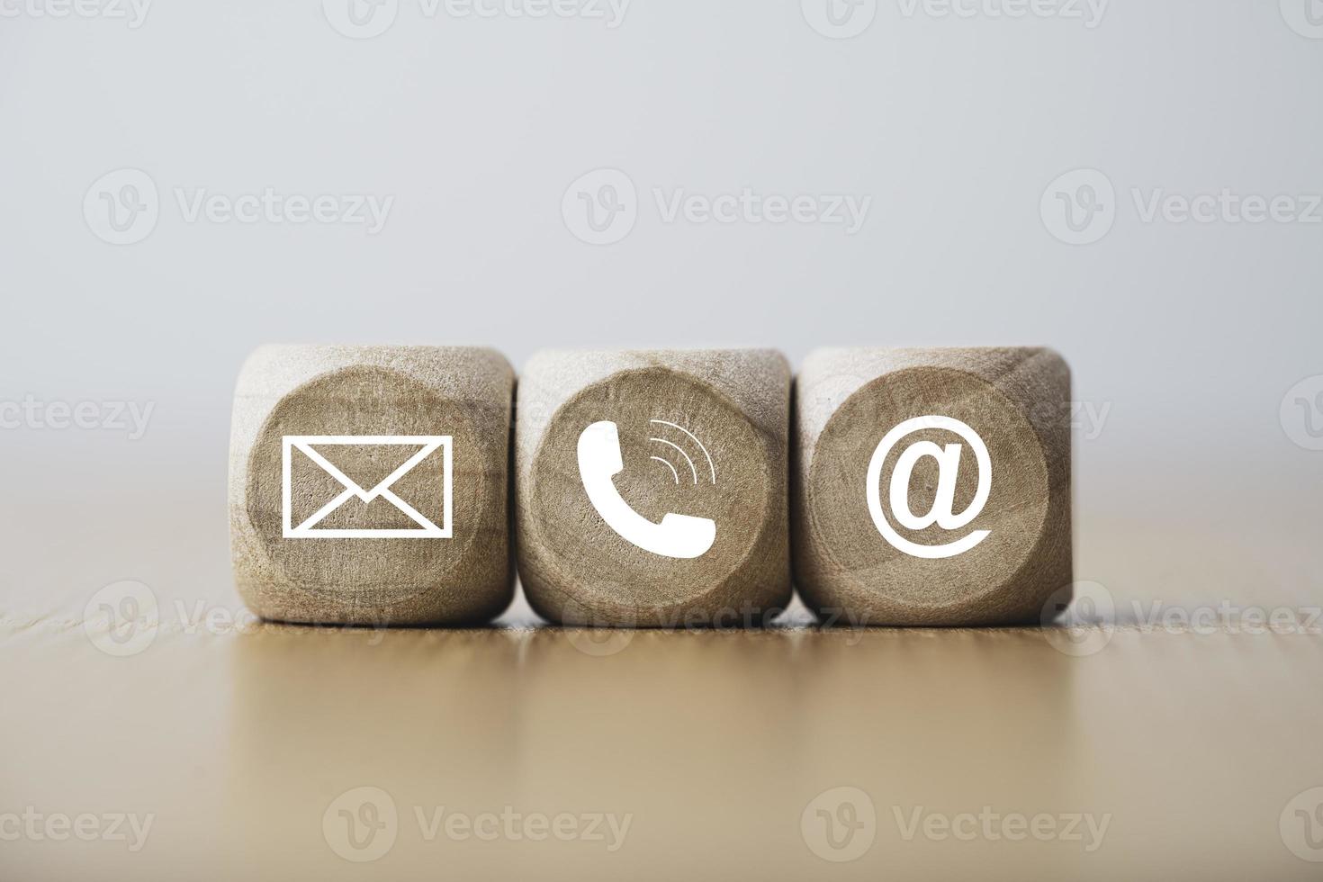 Customer service and business contact concept, wooden cube block which print screen letter , telephone email address and message. photo