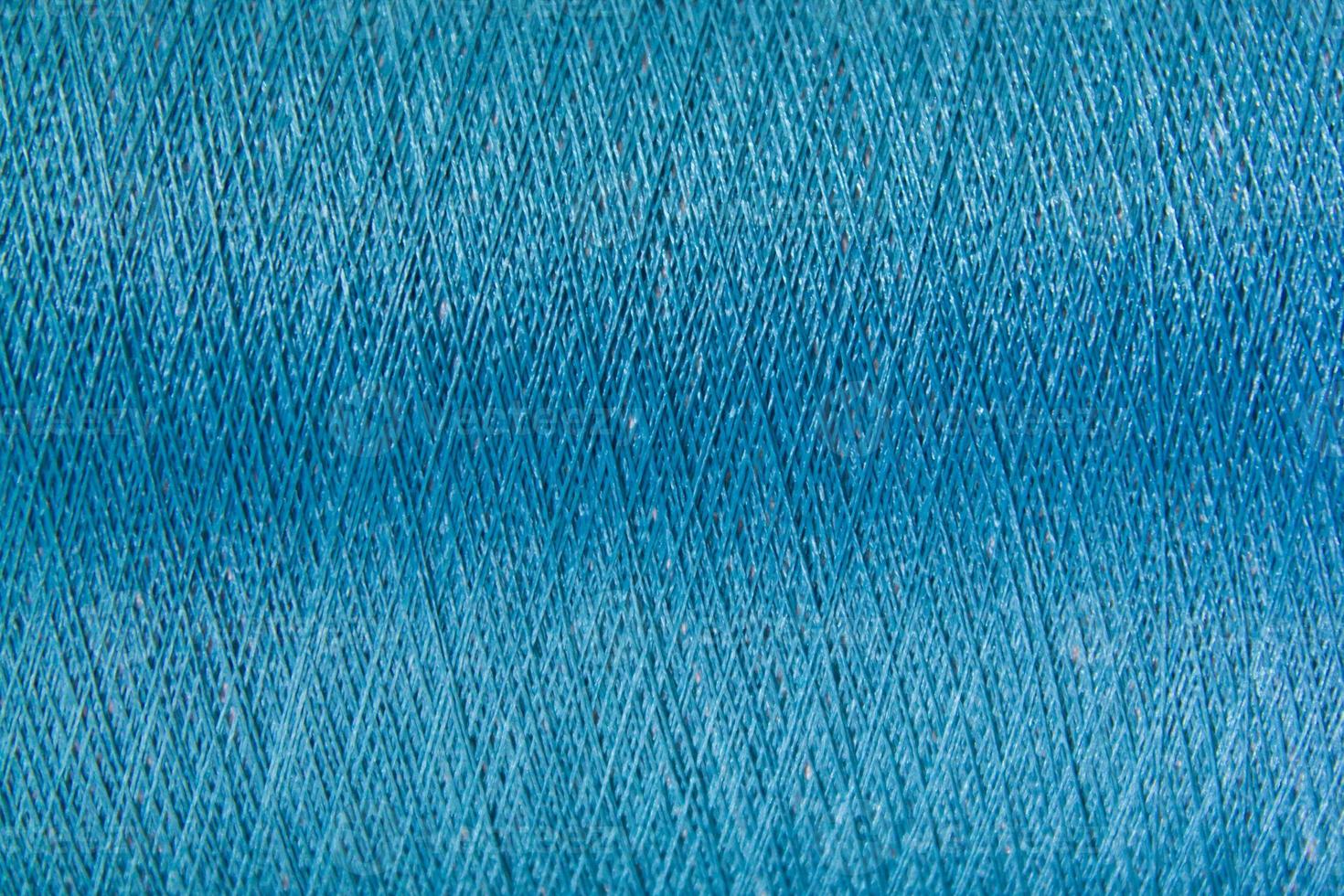 Closed up of blue color thread texture background photo