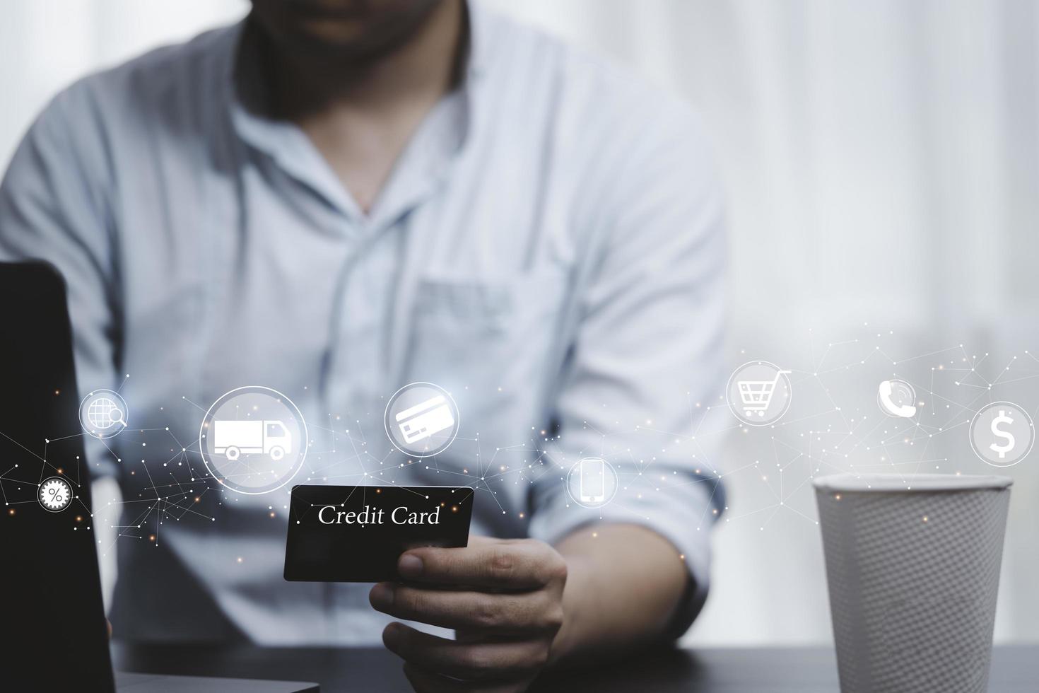 Shopper holding credit card and input shopping order by use computer laptop with online shopping and e-commerce icon concept. photo