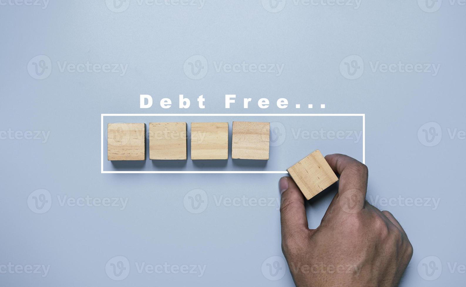 Hand putting wooden cube block for debt progressive result concept. photo