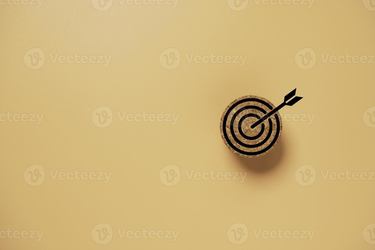 Target board on circle wooden block for setup objective target for business concept. photo