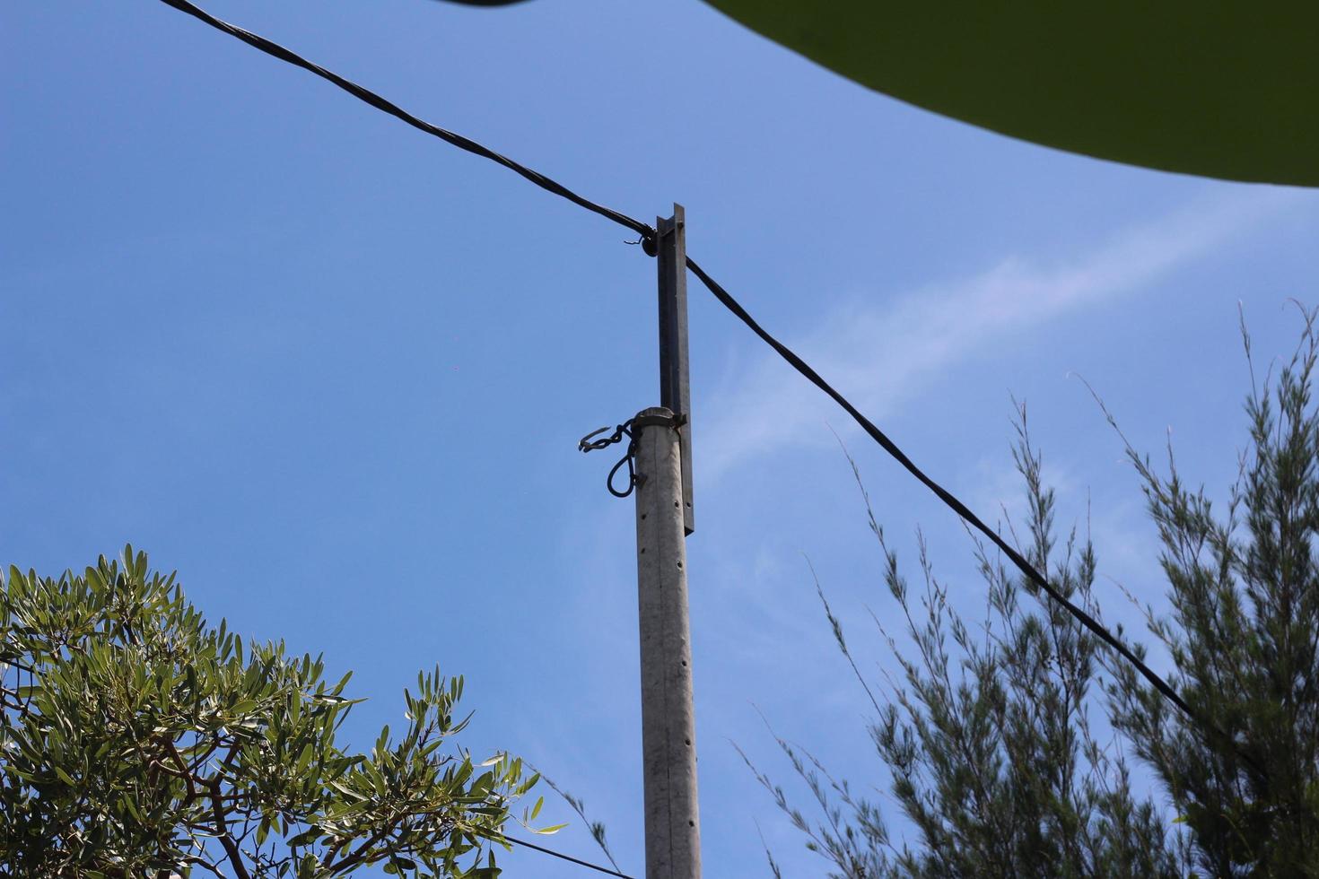 electric pole beside the road photo