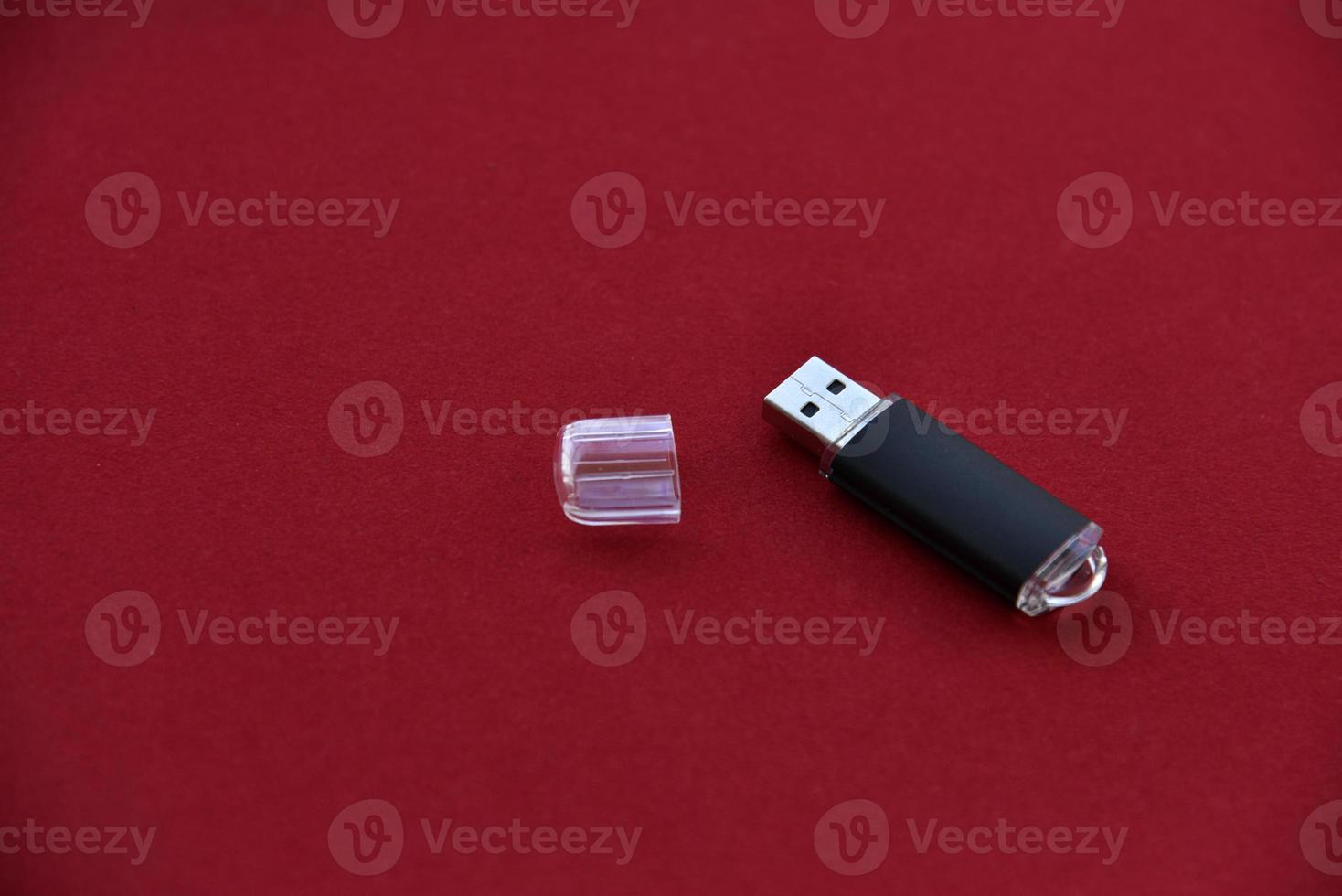 USB flash drive on a red background photo