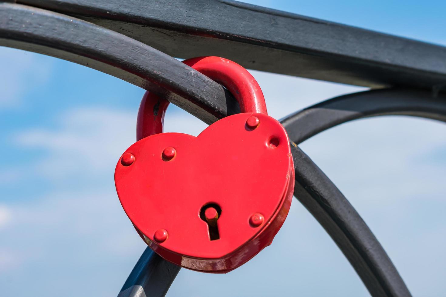 The tradition of hanging a padlock on the railing of a bridge as a symbol of love photo