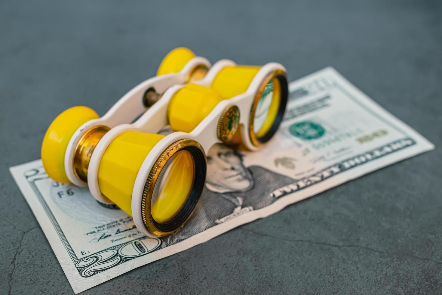 Old theater binoculars and twenty dollar bill photo