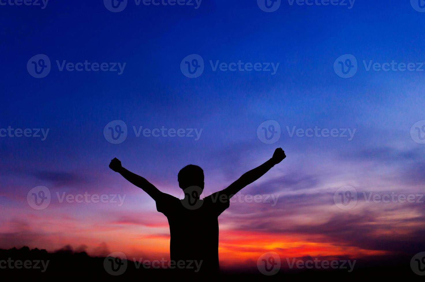 The silhouette of a man who enjoys life Freedom expressed by gestures, concepts, silhouettes photo