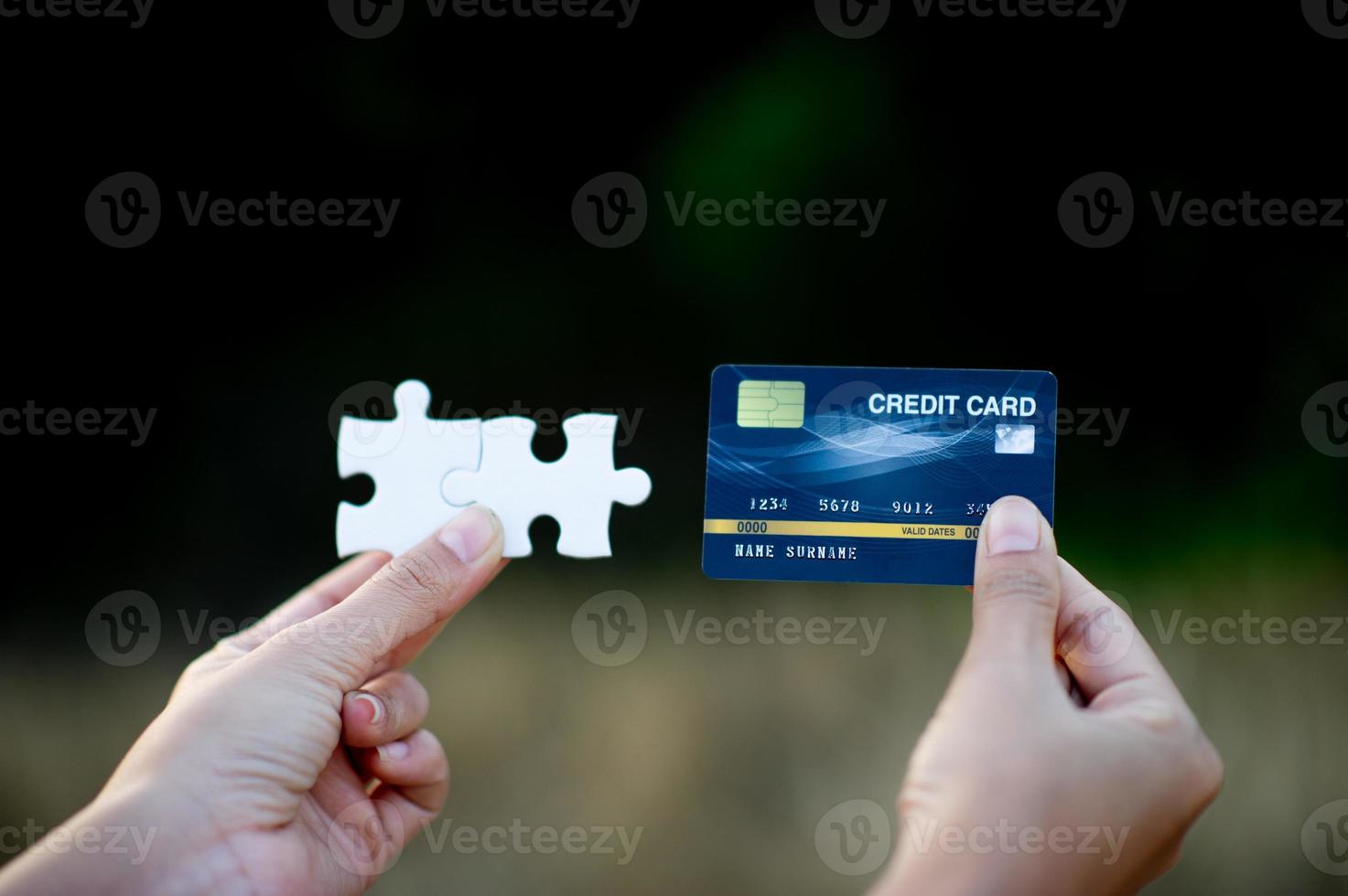 Hand and credit cards, online business operations, and cashless purchases Credit card ideas for shopping photo