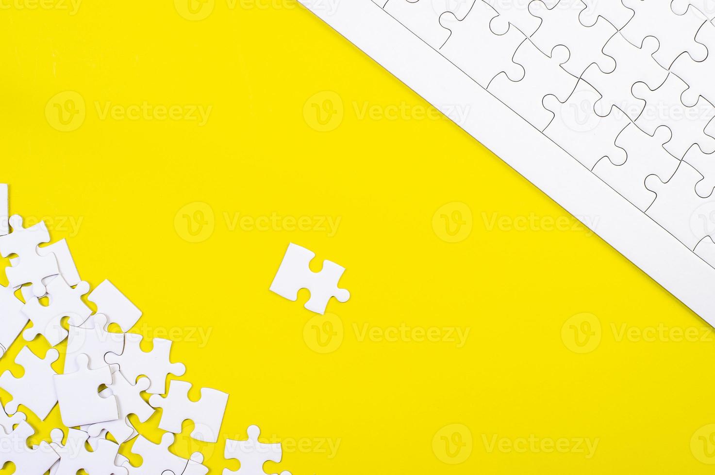 A jigsaw puzzle on a yellow background Business idea photo