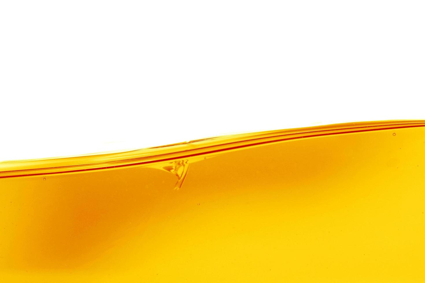 Wave of oil viscosity and air bubbles inside oil isolated on white background. photo