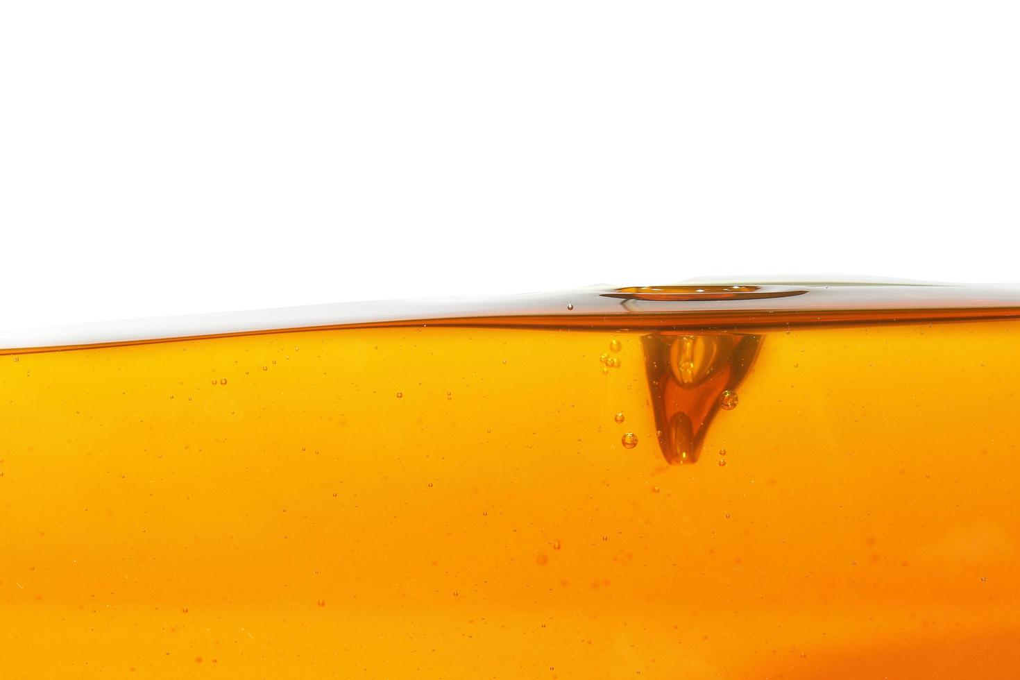 Wave of oil viscosity and air bubbles inside oil isolated on white background. photo