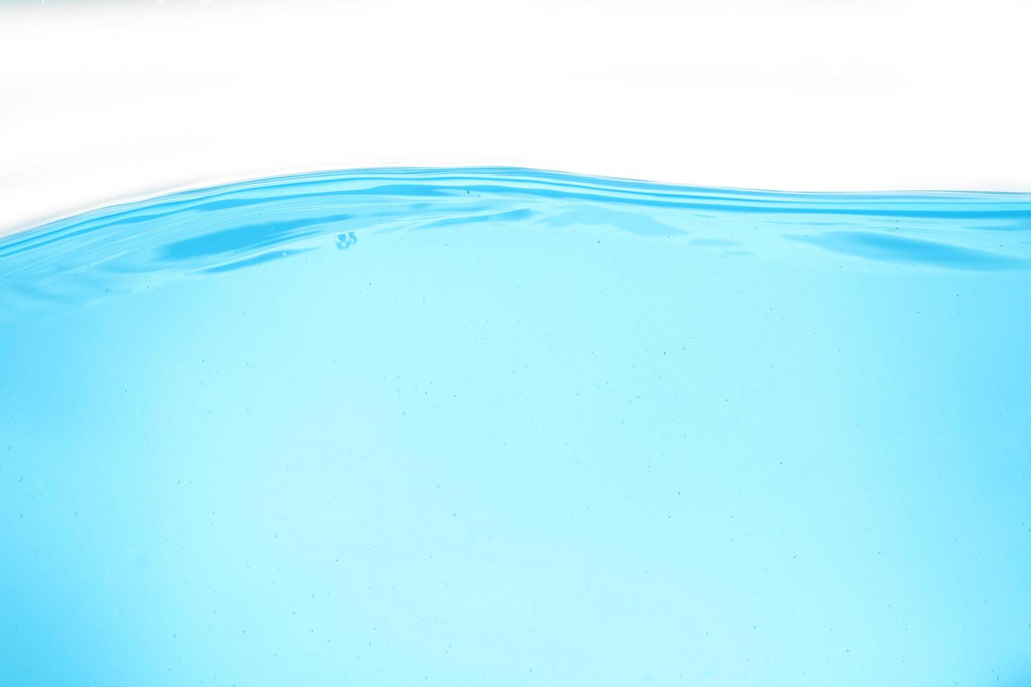 Blue surface water and air bubble isolated on white background photo