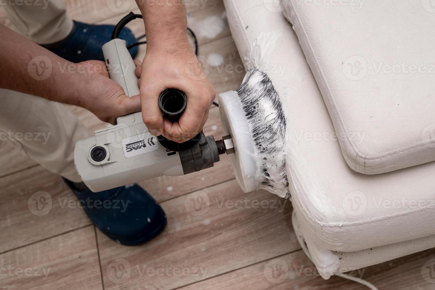 Cleaning a dirty sofa with a sofa washer photo