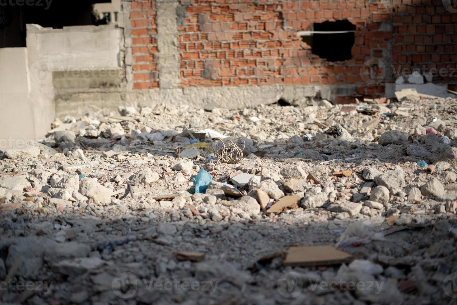 Ruined construction site with stones around photo