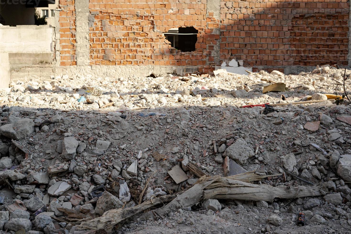 Ruined construction site with stones around photo