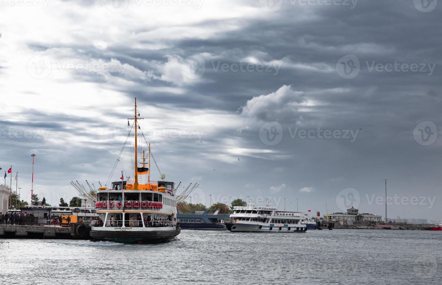 Passenger ferry at sea with cloudy sky photo