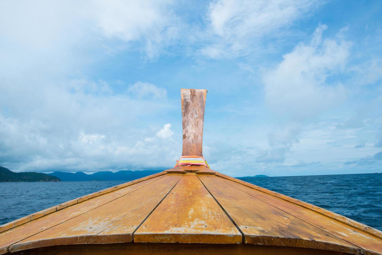 Southern Thai style boat in the Andaman sea of Thailand. Boat is the famous transportation and the traditional iconic of the people in Southern region of Thailand. photo