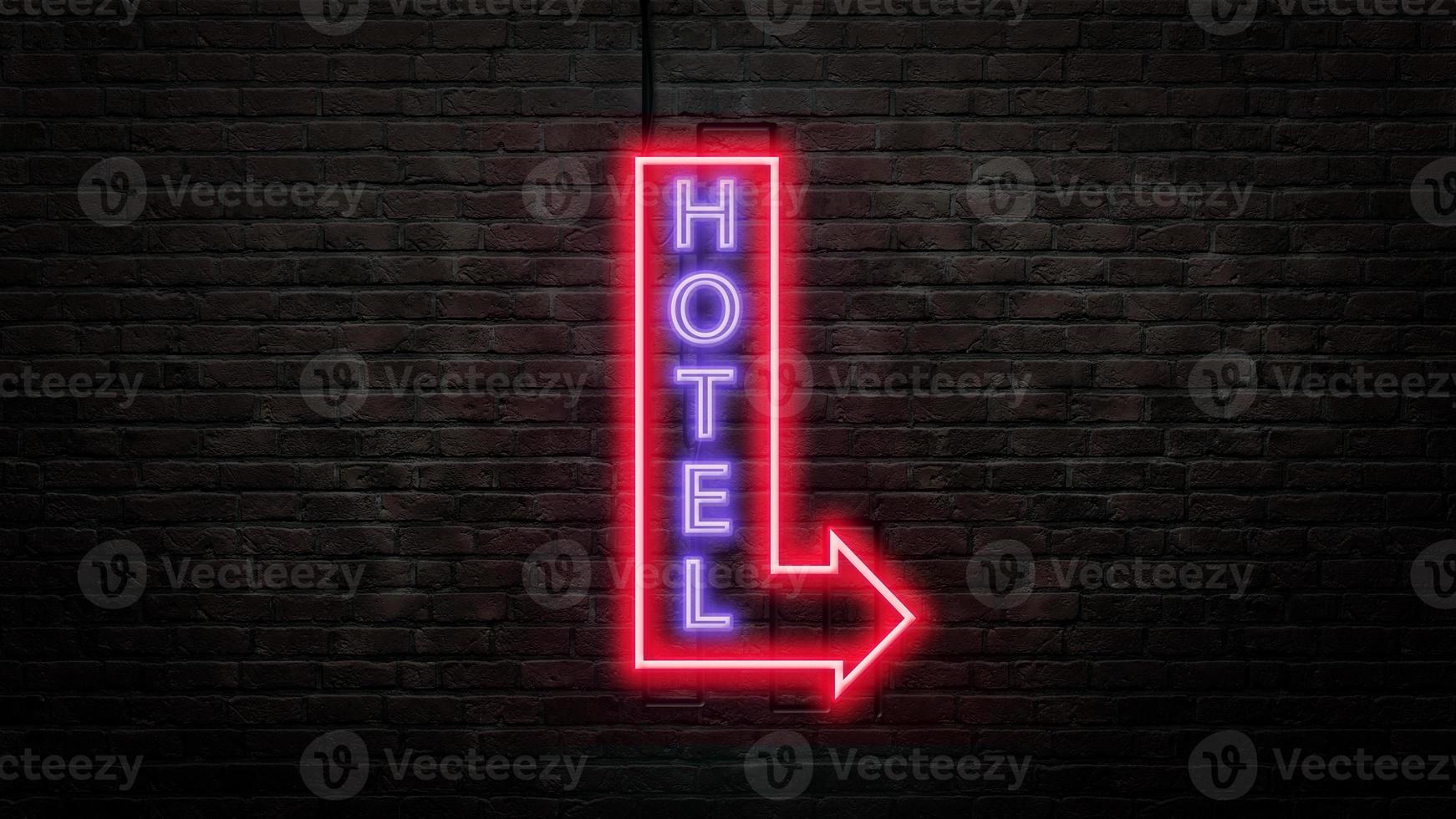 emblema de la señal del hotel en estilo neón en el fondo de la pared de ladrillo foto