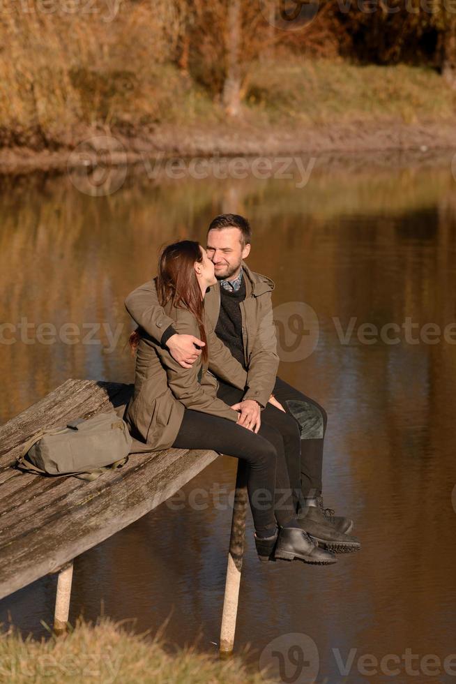 Lovely couple spending autumn day outdoors photo