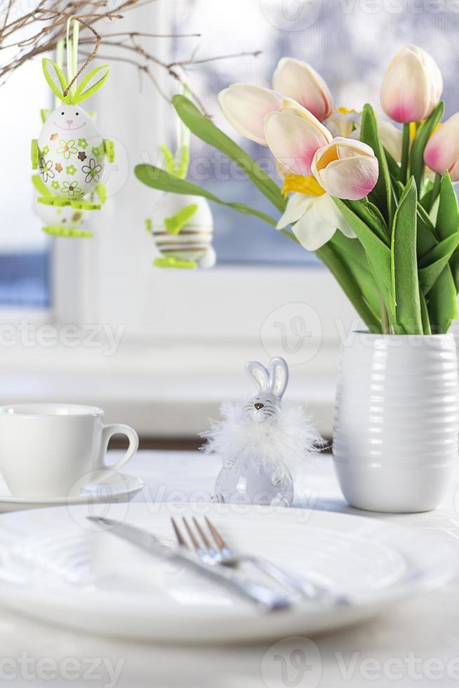 Easter table setting. Easter dinner with colorful Easter eggs. Easter background. Christ is risen photo