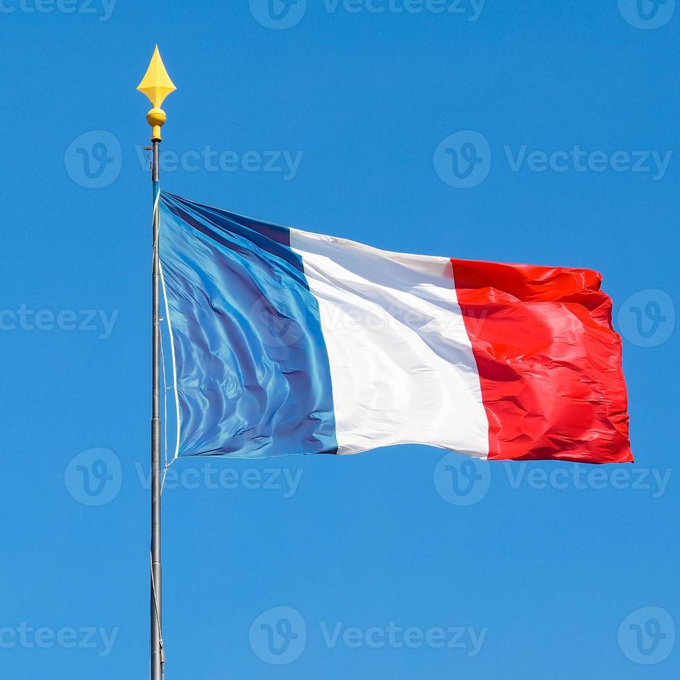 France tricolor flag waving into blue sky photo