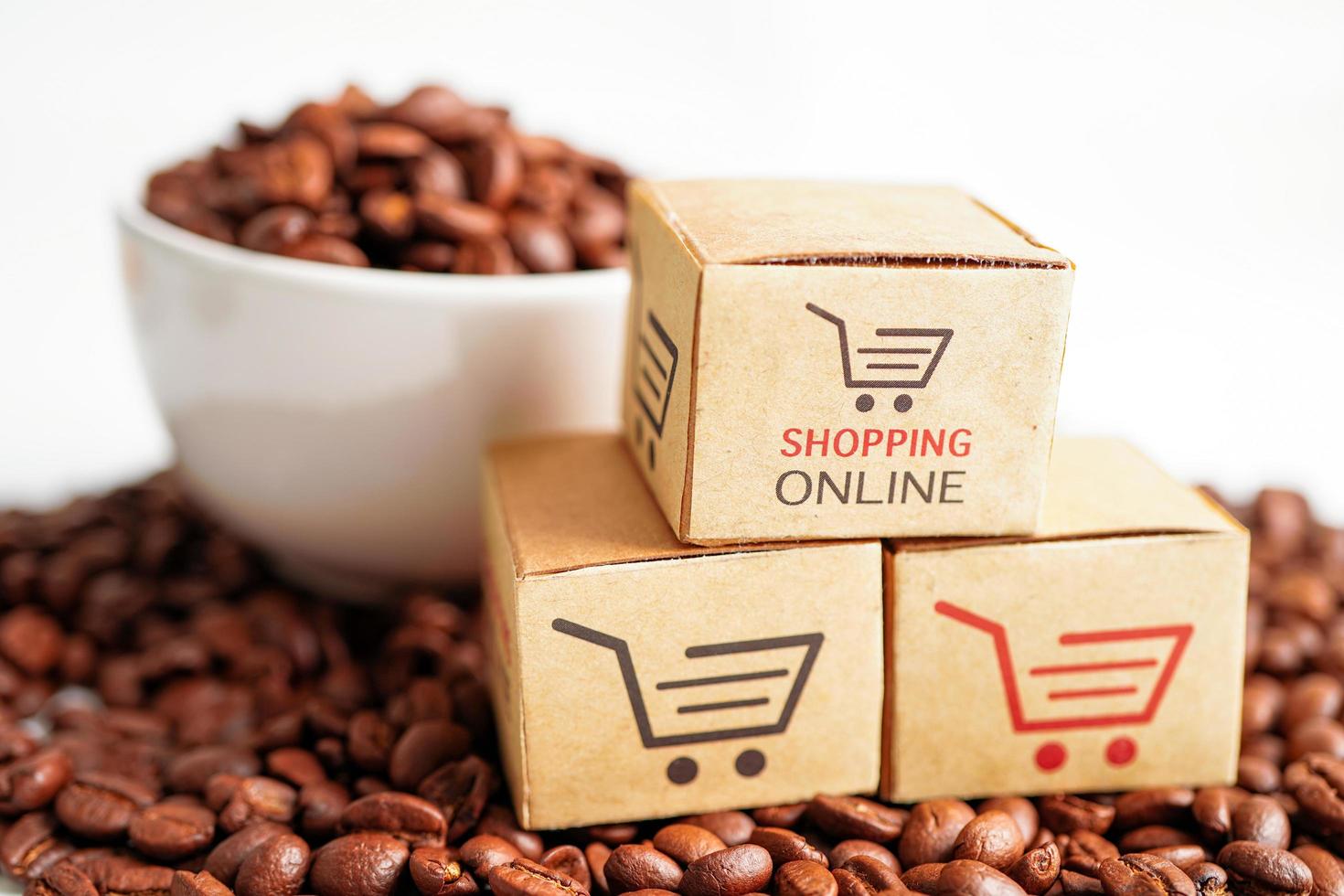 Shopping cart box on coffee beans, shopping online for export or import. photo
